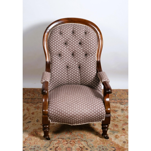 212 - A 19TH CENTURY MAHOGANY AND UPHOLSTERED ARMCHAIR the shaped top rail above a buttoned upholstered ba... 