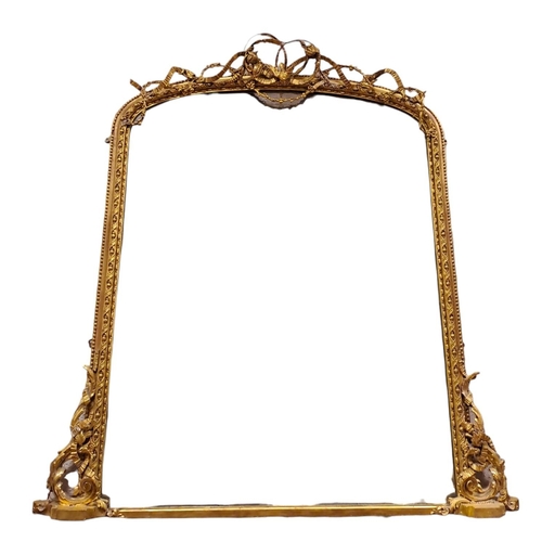 260 - A 19TH CENTURY GILTWOOD AND GESSO OVERMANTEL MIRROR the rectangular arched plate within an egg and d... 