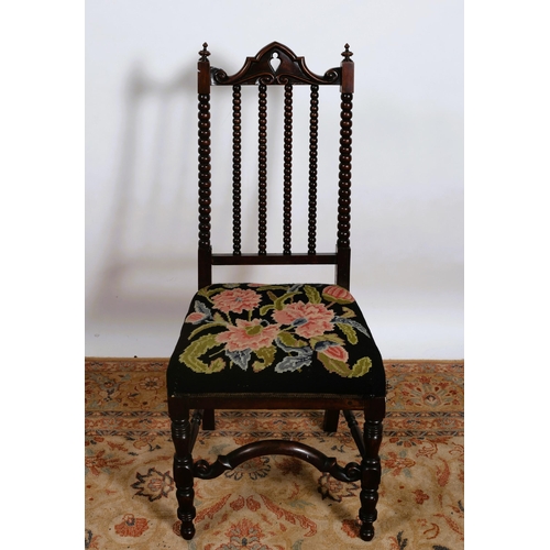 293 - A 19TH CENTURY ROSEWOOD OCCASIONAL CHAIR the shaped top rail with bobbin splats and needlework uphol... 