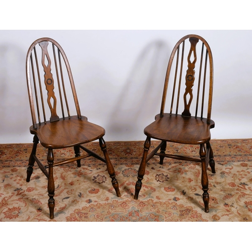 294 - A PAIR OF VINTAGE ELM WOOD CHAIRS each with a curved top rail and pierced vertical splats with shape... 