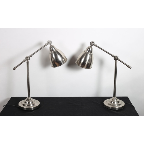 296 - A PAIR OF VINTAGE CHROME TABLE LAMPS each with a tubular column with adjustable arm and dome shade r... 