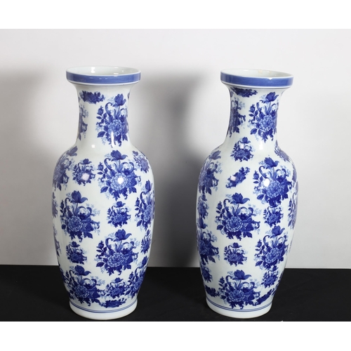 308 - A PAIR OF IRONSTONE BLUE AND WHITE VASES each of baluster form decorated with flowerheads and foliag... 