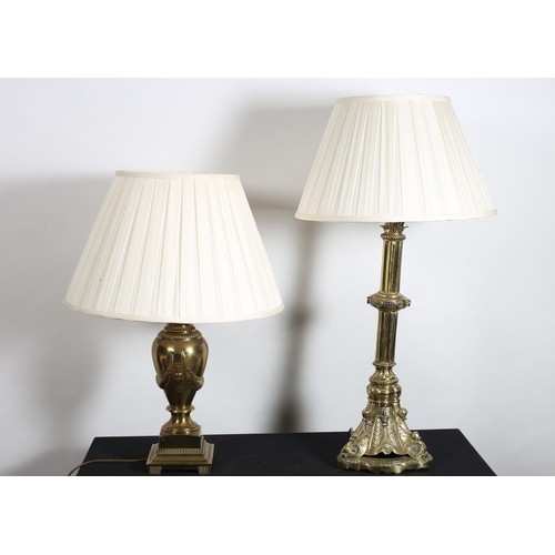 311 - A BRASS TABLE LAMP the cluster column on a triform base with platform support and pleated shade toge... 