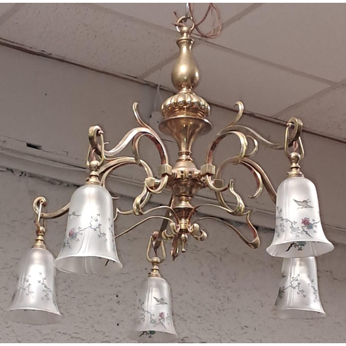 338 - A VINTAGE BRASS CHANDELIER the baluster column issuing six pierced scroll arms with frosted glass sh... 