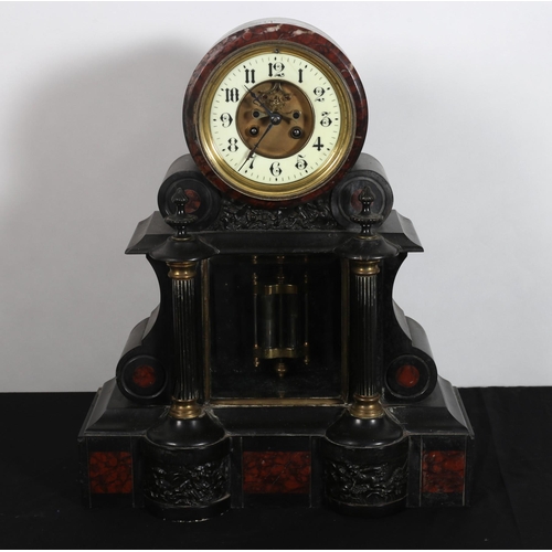 343 - A 19TH CENTURY BLACK SLATE AND MAROON MARBLE MANTEL CLOCK of architectural outline the cylindrical d... 