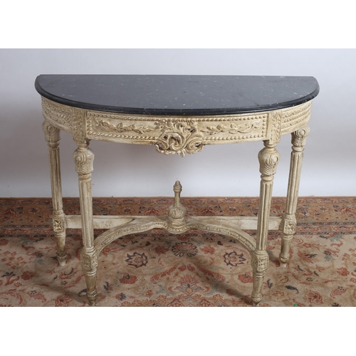 361 - A CONTINENTAL CREAM PAINTED AND MARBLE CONSOLE TABLE of demi lune outline surmounted by a black vein... 