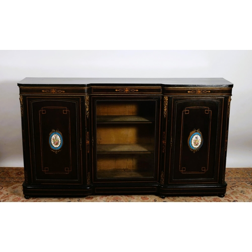 367 - A 19TH CENTURY EBONISED SATINWOOD AND GILT BRASS MOUNTED SIDE CABINET of inverted breakfront outline... 