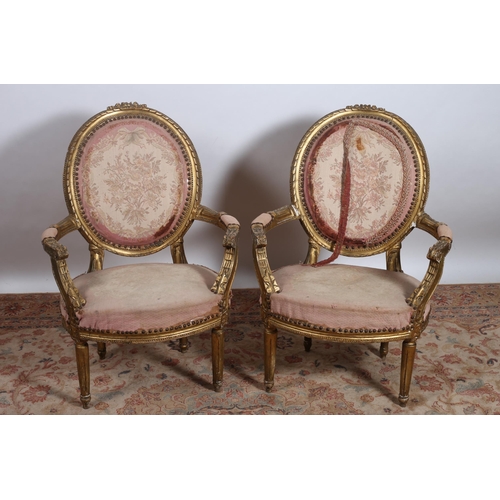 368 - A PAIR OF 19TH CENTURY CONTINENTAL GILTWOOD AND UPHOLSTERED ELBOW CHAIRS each with an oval upholster... 