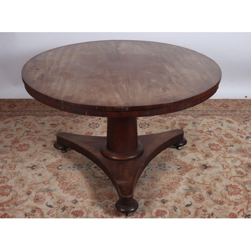 378 - A 19TH CENTURY MAHOGANY POD TABLE the circular moulded top above a cylindrical column on a shaped pl... 