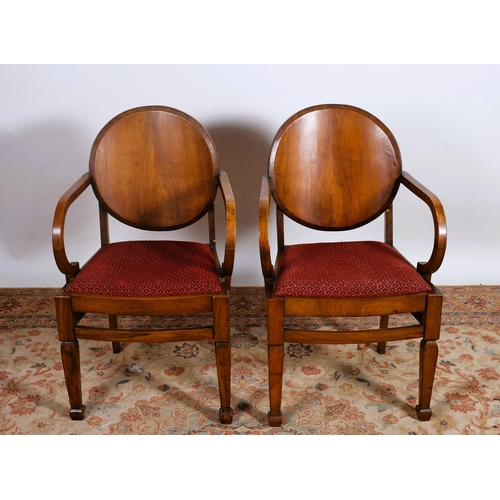 381 - A PAIR OF VINTAGE WALNUT AND UPHOLSTERED ARMCHAIRS each with an oval shaped back with upholstered dr... 