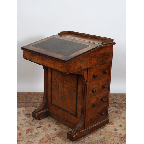 388 - A 19TH CENTURY WALNUT DAVENPORT the tooled leather writing slope flanked by four long drawers with o... 