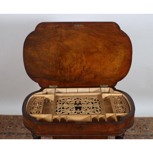 391 - A VICTORIAN WALNUT AND SATINWOOD INLAID WORK BOX of serpentine outline the hinged lid containing lid... 