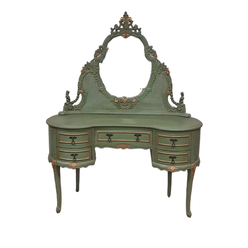 396 - A CONTINENTAL GREEN PAINTED AND PARCEL GILT DRESSING TABLE the superstructure with shaped  mirror an... 