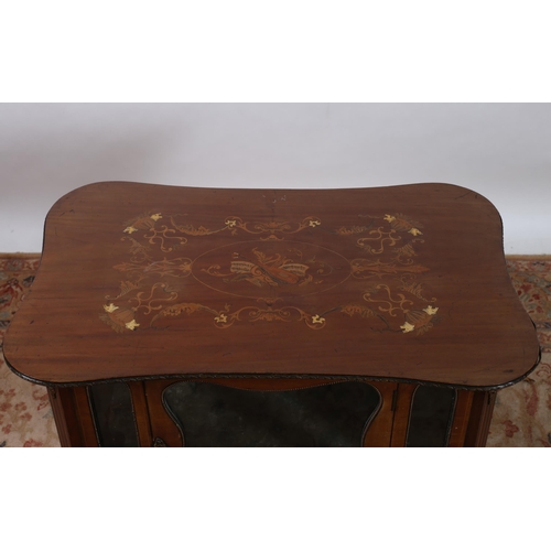 398 - AN EDWARDIAN MAHOGANY INLAID AND GILT BRASS MOUNTED CURIO CABINET of serpentine outline the shaped t... 