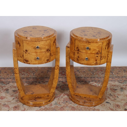 427 - A PAIR OF ART DECO DESIGN WALNUT PEDESTALS each of circular outline the stepped top above two frieze... 