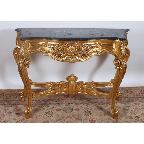 432 - A CONTINENTAL CARVED GILTWOOD AND MARBLE CONSOLE TABLE of serpentine outline with black veined marbl... 