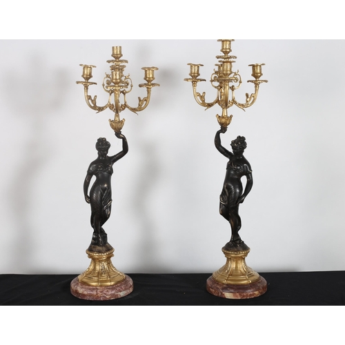 436 - A PAIR OF CONTINENTAL GILT BRONZE AND MARBLE FIGURAL TABLE LAMPS each modelled as a classical female... 