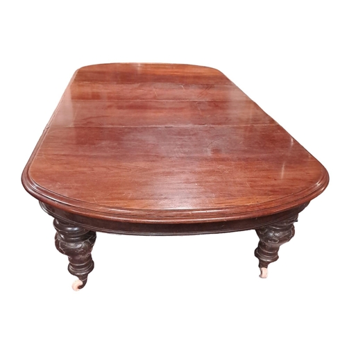 453 - A 19TH CENTURY MAHOGANY TELESCOPIC DINING TABLE of rectangular form with rounded ends and three loos... 