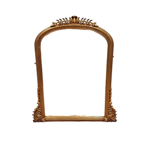 458 - A VICTORIAN DESIGN GILT FRAME OVERMANTEL MIRROR the rectangular arched plate within a beadwork mould... 