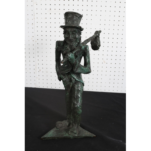 505 - A CAST BRONZE FIGURE modelled as a gentleman of the road shown standing on a triangular base 
42cm (... 