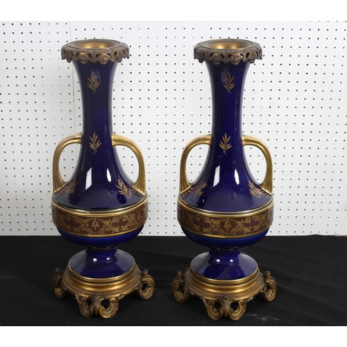 506 - A PAIR OF FRENCH SEVRES GILT AND GILT BRASS VASES by Pinon - Heuze each of urn form decorated with s... 