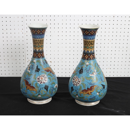 511 - A PAIR OF ORIENTAL VASES each of baluster form the turquoise ground decorated with butterflies among... 