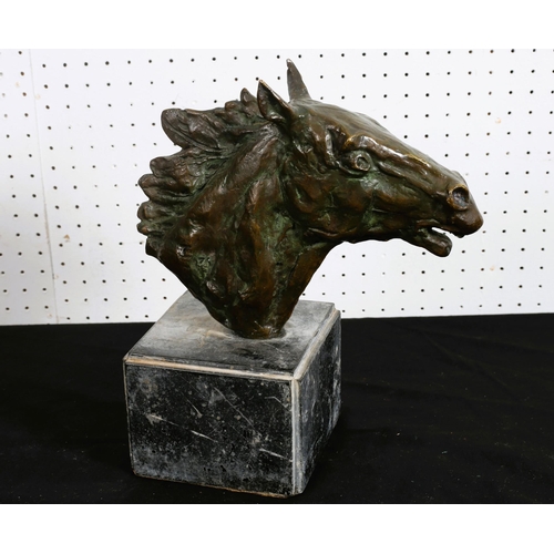 512 - A BRONZE SCULPTURE modelled as a horse's head raised on a veined marble base 
28cm (h) x 22cm (w) x ... 