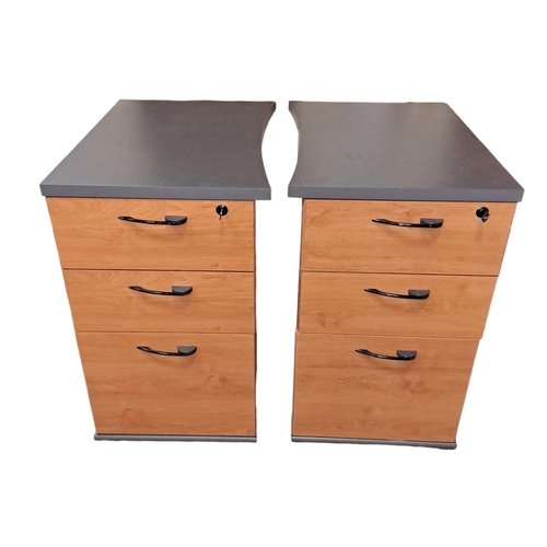 603 - A PAIR OF SIMULATED TEAK AND MELAMINE PEDESTALS each of rectangular form with two long and one deep ... 