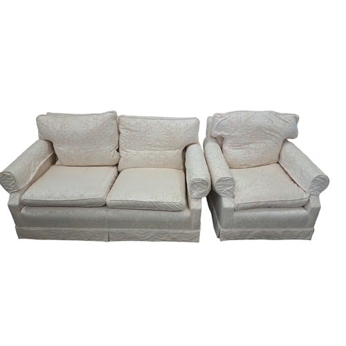 608 - A TWO PIECE SUITE comprising a two seater settee the rectangular upholstered back with loose cushion... 