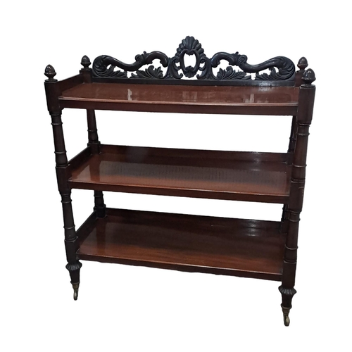 610 - A MATCHED PAIR OF 19TH CENTURY CARVED MAHOGANY THREE TIER DUMBWAITERS each with a pierced foliate ca... 