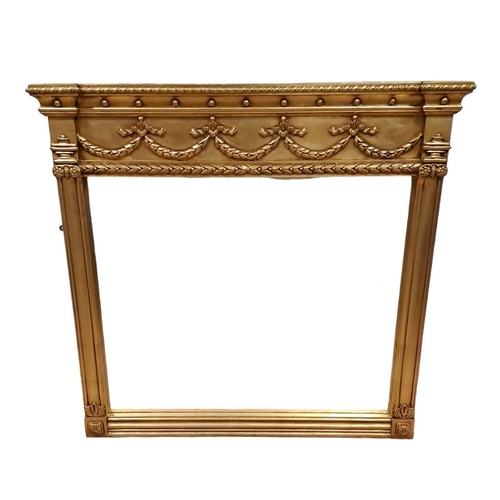 617 - A REGENCY DESIGN GILT FRAME OVERMANTEL MIRROR the rectangular plate within a pilaster frame with urn... 