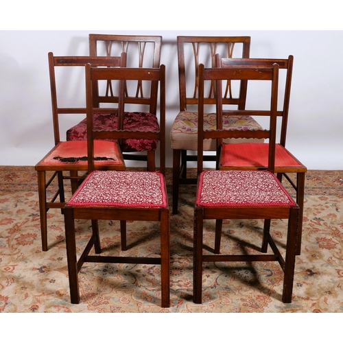 625 - A PAIR OF GEORGIAN MAHOGANY FORK BACK DINING CHAIRS with upholstered seats on square tapering legs t... 