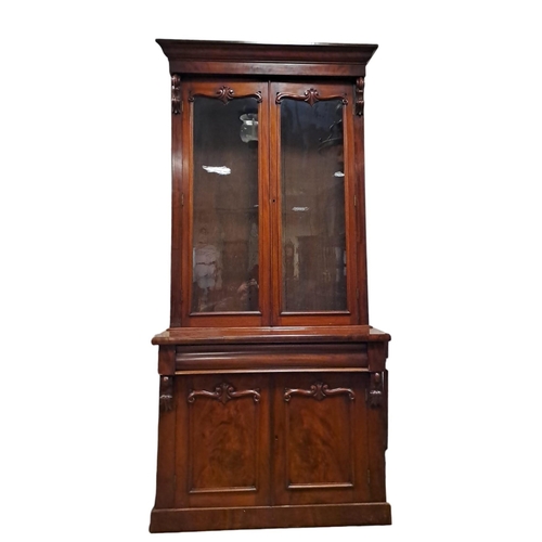 63 - A 19TH CENTURY MAHOGANY LIBRARY BOOKCASE the moulded cornice above a pair of glazed doors containing... 