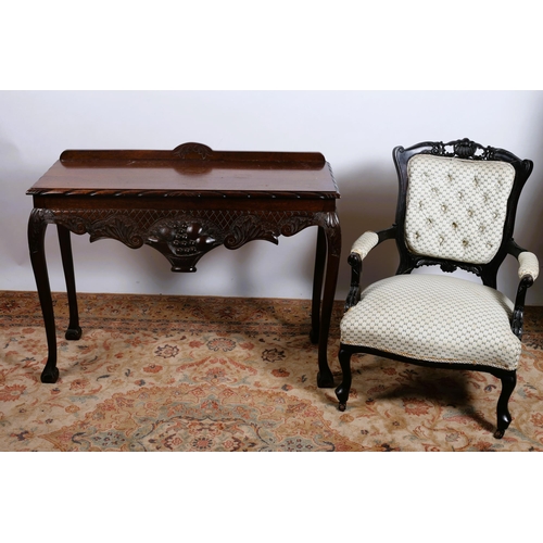 633 - A CHIPPENDALE DESIGN MAHOGANY SIDE TABLE of rectangular outline with gadrooned rim and carved frieze... 