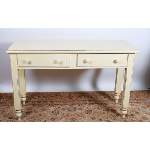 634 - A CREAM PAINTED SEAT of rectangular outline the moulded back above a hinged compartment the base on ... 