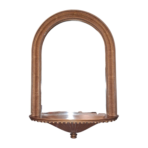 683 - A CONTINENTAL GILT FRAME MIRROR the rectangular arched bevelled glass plate within a reeded and bead... 