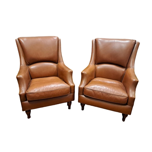 70 - A PAIR OF VINTAGE HIDE UPHOLSTERED LIBRARY CHAIRS each with a curved upholstered back and seat with ... 