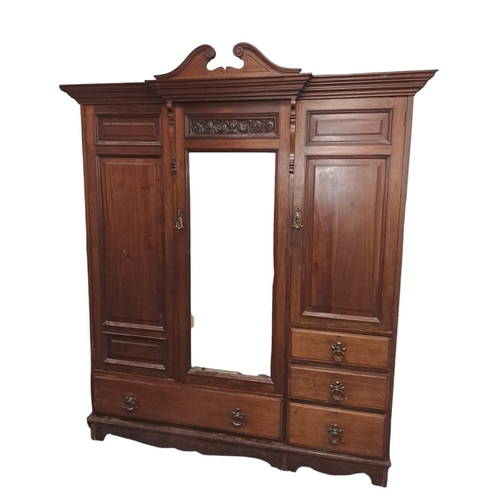 757 - A THREE PIECE EDWARDIAN MAHOGANY BEDROOM SUITE by Thomas Turner Manchester comprising a three door w... 