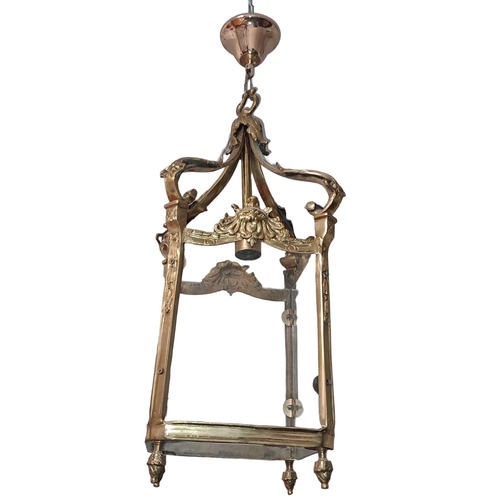 788 - A GILT BRASS AND CLEAR GLASS SINGLE LIGHT HALL LANTERN of square form with foliate decoration 
77cm ... 