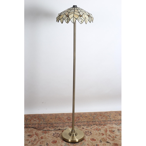 79 - A TIFFANY DESIGN GILT BRASS FLOOR STANDARD LAMP the panel shade with topaz stone inset above a reede... 