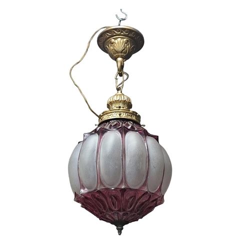 790 - A VINTAGE GILT BRASS FROSTED GLASS AND RUBY GLASS CENTRE LIGHT of bulbous form 
60cm drop