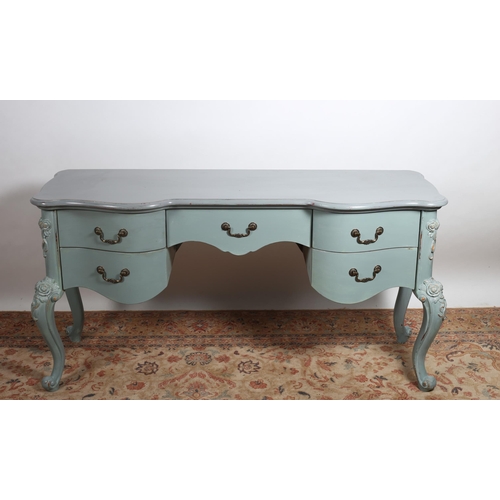 82 - A CONTINENTAL GREY PAINTED SIDE TABLE of serpentine outline the shaped top with five frieze drawers ... 