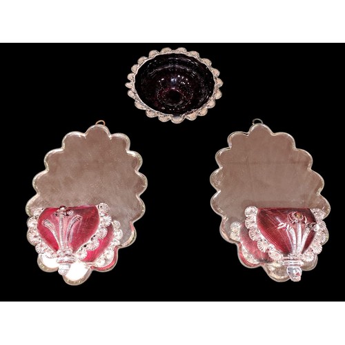 813 - A PAIR OF 19TH CENTURY RUBY AND CLEAR GLASS MIRRORS the shaped back plate with ruby posies etc. (3)