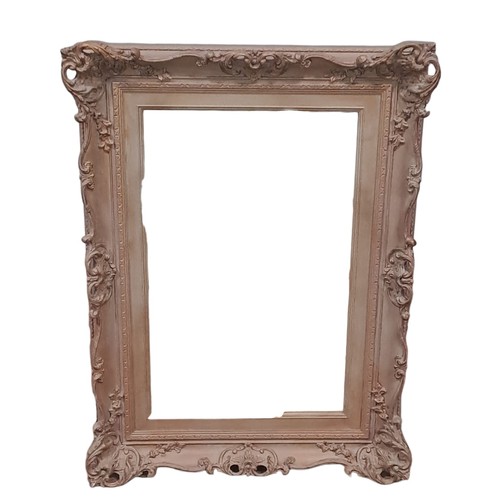 649 - A GILT FRAME MIRROR the rectangular plate within a foliate and flowerhead frame 
98cm (h) x 71cm (w)