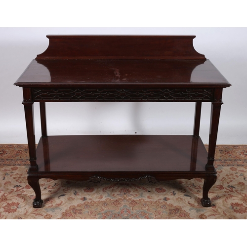 646 - A CHIPPENDALE DESIGN MAHOGANY TWO TIER SIDE TABLE of rectangular outline the shaped top with moulded... 