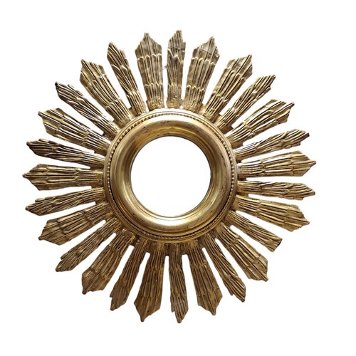 585 - A CONTINENTAL GILT FRAME SUNBURST MIRROR with circular bevelled glass plate
69cm (d) (En Suite to th... 