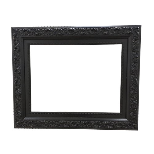 691 - AN EBONISED FRAME MIRROR THE RECTANGULAR PLATE with a foliate decorate frame
68 cm (h) x 82 cm (w)