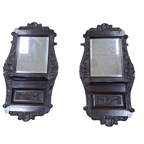 782 - A PAIR OF EDWARDIAN CARVED WALL MOUNTED SHELVES WITH MIRRORED