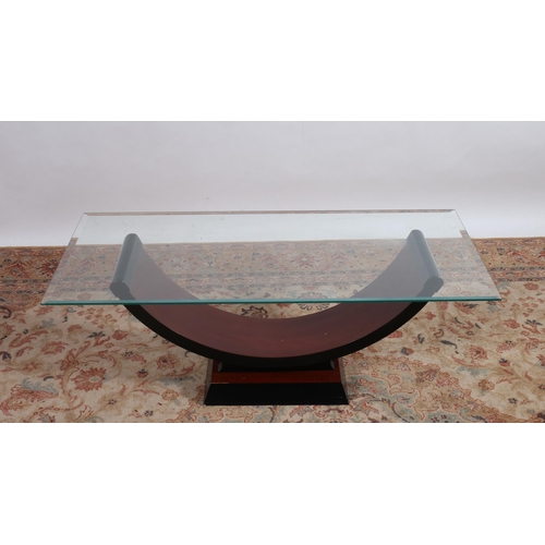 735 - A CONTEMPORARY CHERRYWOOD EBONISED AND GLAZED COFFEE TABLE of rectangular outline the shaped top rai... 