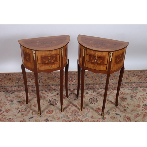 88 - A PAIR OF CONTINENTAL KINGWOOD AND GILT BRASS MOUNTED SIDE TABLES of demi lune outline the shaped to... 